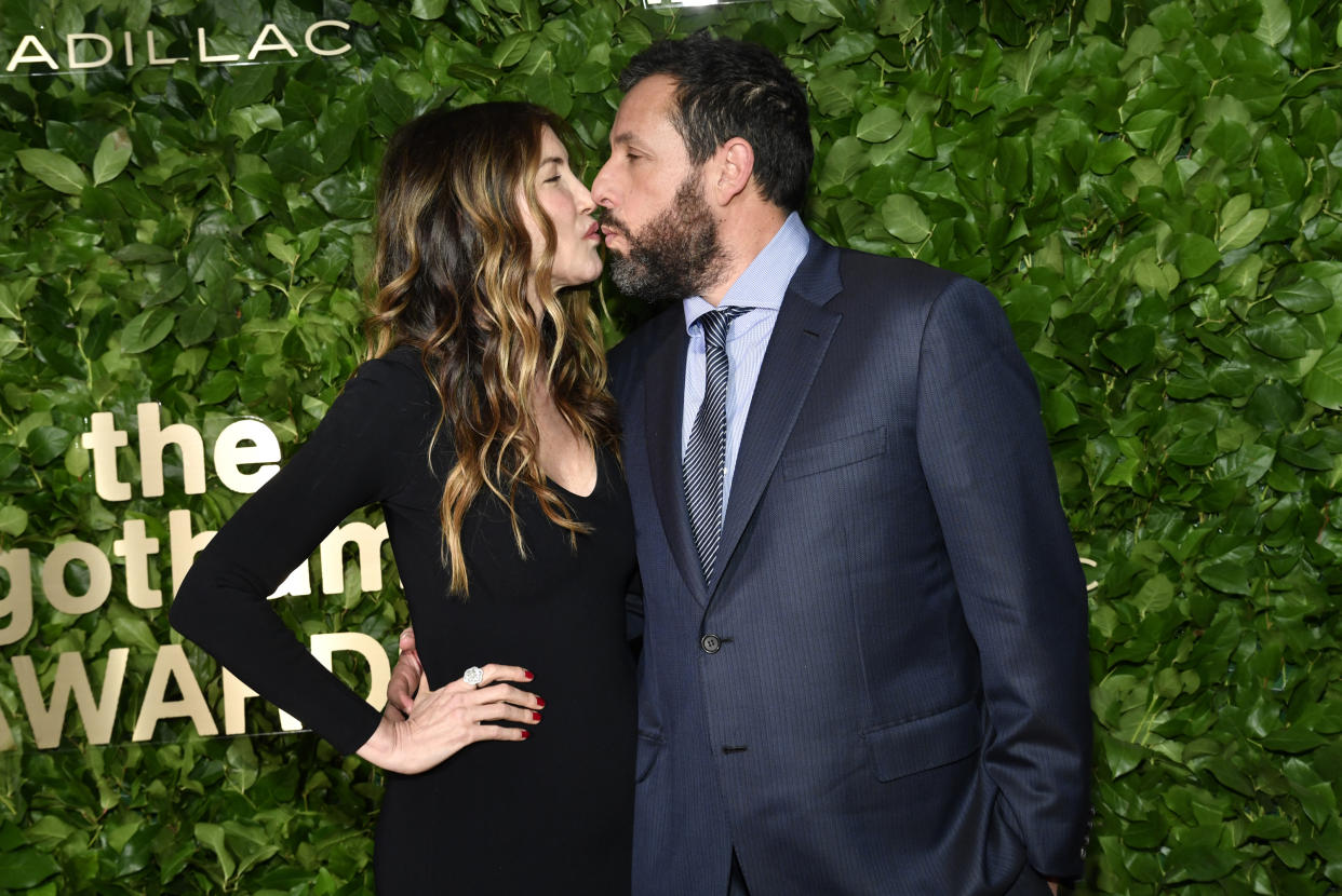 Adam Sandler, right, kisses Jackie Sandler at the Gotham Independent Film Awards at Cipriani Wall Street on Monday, Nov. 28, 2022, in New York. (Photo by Evan Agostini/Invision/AP)