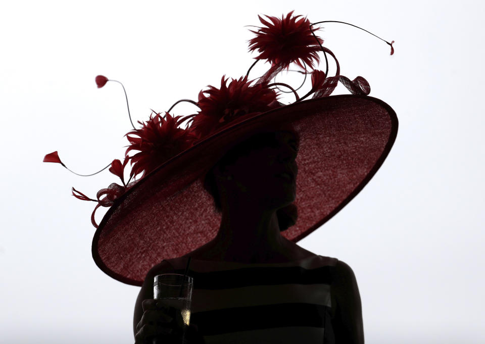 <p>A woman wears a hat before the 144th running of the Kentucky Derby horse race at Churchill Downs Saturday, May 5, 2018, in Louisville, Ky. (Photo: John Minchillo/AP) </p>