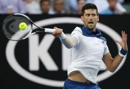 Tennis - Australian Open - Rod Laver Arena, Melbourne, Australia, January 22, 2018. Novak Djokovic of Serbia hits a shot against Chung Hyeon of South Korea. REUTERS/Issei Kato