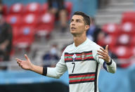 Portugal's Cristiano Ronaldo reacts during the Euro 2020 soccer championship group F match between Hungary and Portugal at the Ferenc Puskas stadium in Budapest, Hungary, Tuesday, June 15, 2021. (Tibor Illyes/Pool via AP)