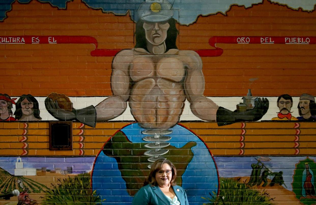 Mayor Mila Besich in front of a mural