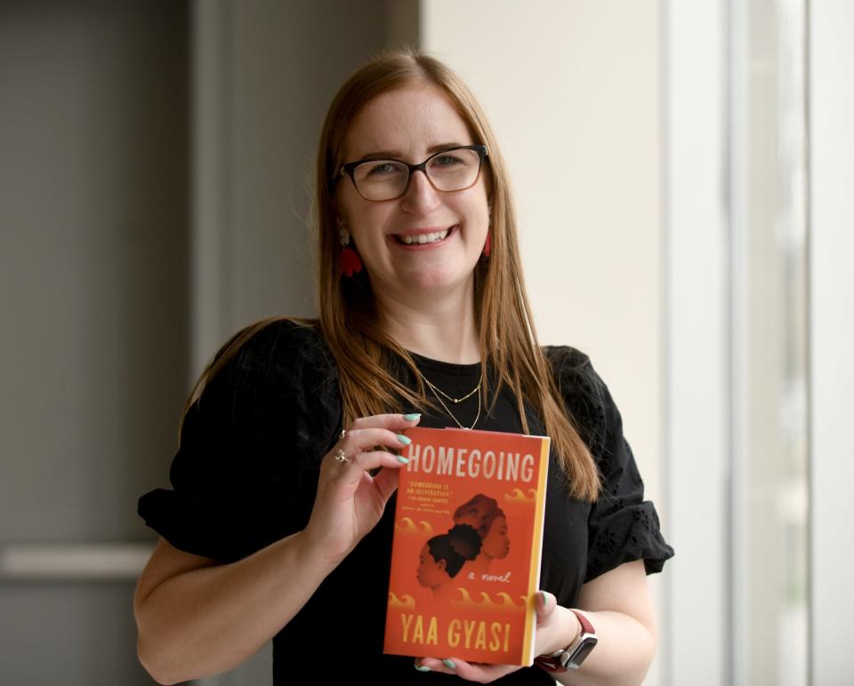 Stephanie Toole, Massillon Museum's education and outreach manager and NEA Big Read coordinator, holds the 2024 Big Read selection, "Homegoing" by Yaa Gyasi.
