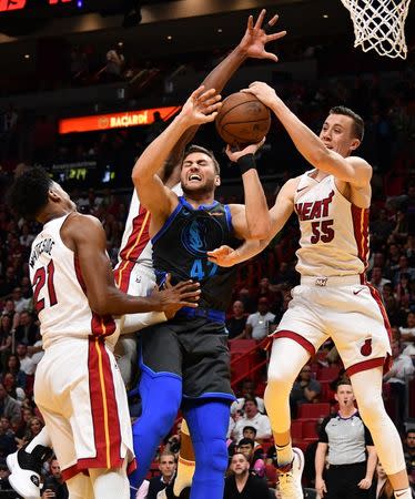 Mar 28, 2019; Miami, FL, USA; Miami Heat forward Duncan Robinson (55) blocks the shot of Dallas Mavericks forward Maximilian Kleber (42) during the second half at American Airlines Arena. Mandatory Credit: Jasen Vinlove-USA TODAY Sports