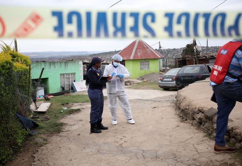 Police work at the scene of a deadly mass shooting near Pietermaritzburg