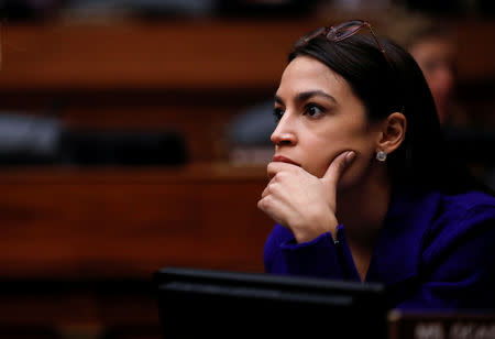 U.S. Rep. Alexandria Ocasio-Cortez (D-NY) listens as the House Oversight and Reform Committee votes to subpoena the White House about security clearances as the committee meets on Capitol Hill in Washington, U.S., April 2, 2019. REUTERS/Carlos Barria