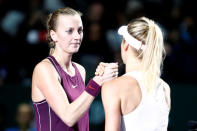 Tennis - WTA Tour Finals - Singapore Indoor Stadium, Kallang, Singapore - October 21, 2018 Ukraine's Elina Svitolina shakes hands with Czech Republic's Petra Kvitova after their group stage match REUTERS/Edgar Su