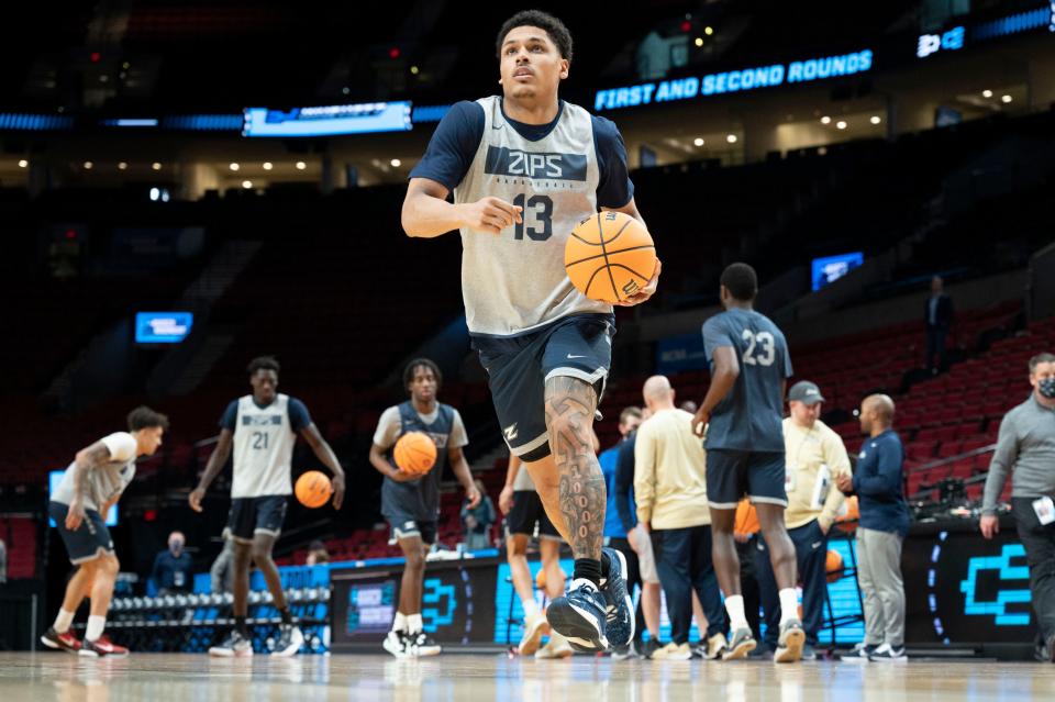 Akron Zips guard Xavier Castaneda (13) warms up with teammates during a practice session at Moda Center in Portland, March 16, 2022.