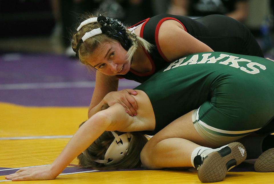 Gilbert's Madison Shannon rides on Woodward-Granger's Grace Sharr during their 115-pound match at the Central Iowa Kickoff Girls Wrestling Tournament at the Nevada High School Field House on Saturday, Nov. 18, 2023, in Nevada, Iowa.