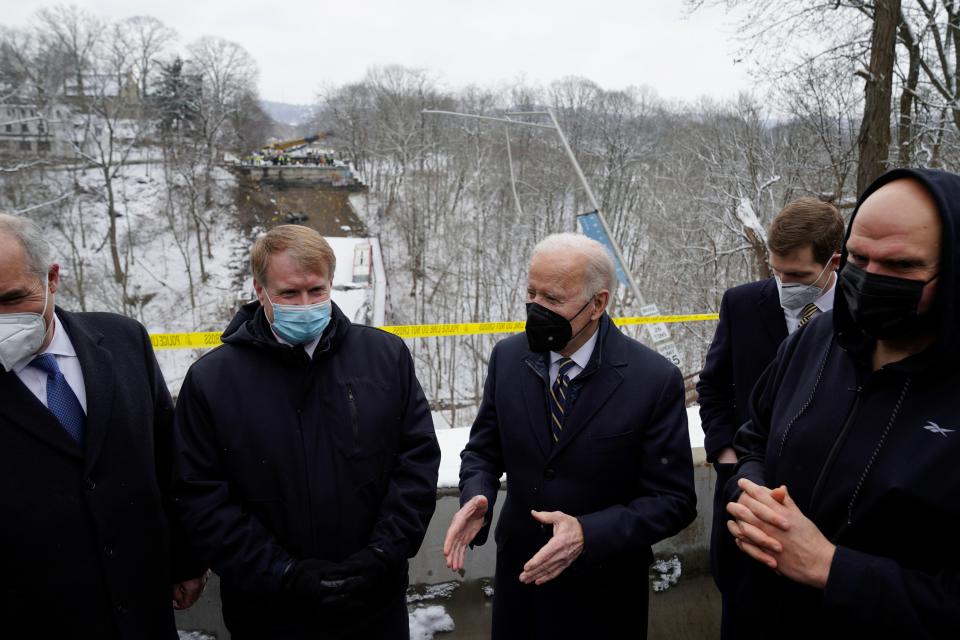 President Joe Biden visits the site where the Fern Hollow Bridge collapsed Friday, Jan. 28, 2022, in Pittsburgh's East End.