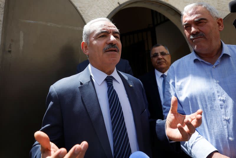 Palestinian Prime Minister Mohammad Shtayyeh speaks to the media outside of Al-Haq office, in Ramallah in the Israeli-Occupied West Bank
