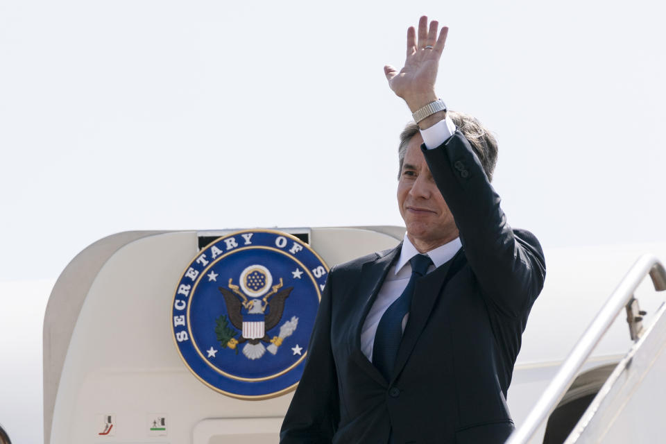 Secretary of State Antony Blinken waves as he boards his plane upon departure from Cairo International Airport, Wednesday, May 26, 2021, in Cairo, Egypt. (AP Photo/Alex Brandon, Pool)