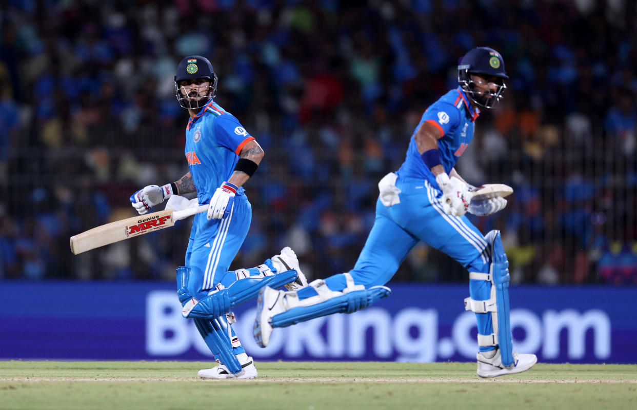 India's Virat Kohli and KL Rahul run between the wickets. (Matthew Lewis/ICC via Getty Images)