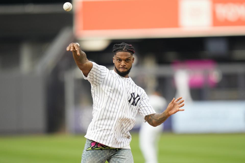 Buffalo Bills defensive back Damar Hamlin throws out a ceremonial first pitch before a baseball game between the New York Yankees and the Baltimore Orioles, Monday, July 3, 2023, in New York. (AP Photo/Frank Franklin II)