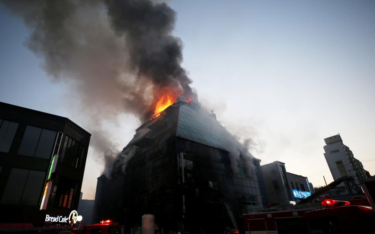 Smoke rises from a burning building in Jecheon, South Korea, December 21  - REUTERS