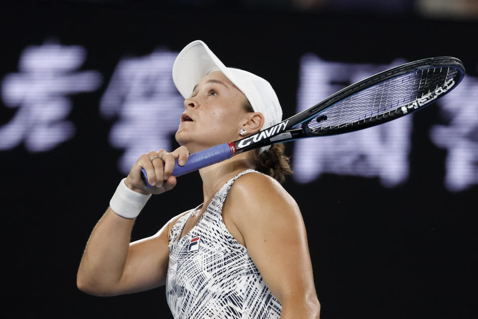 Ash Barty of Australia reacts after defeating Madison Keys of the U.S. in their semifinal match at the Australian Open tennis championships in Melbourne, Australia, Thursday, Jan. 27, 2022. (AP Photo/Hamish Blair)