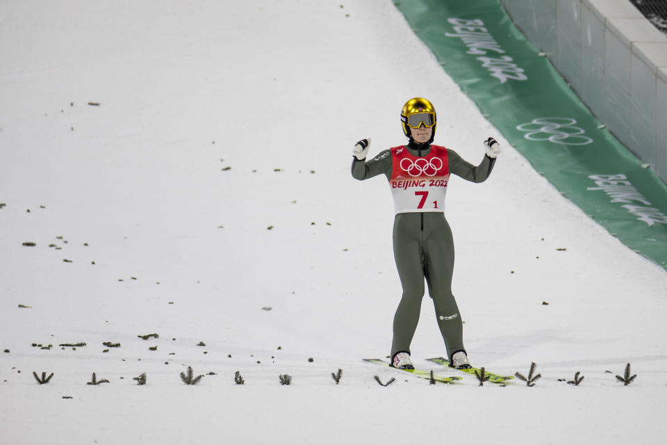 Anna Odine Stroem (pictured) of Norway lands during the ski jumping mixed event.