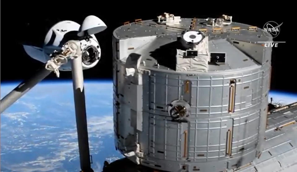 SpaceX's Crew-2 Crew Dragon Endeavour arrives at the International Space Station with four astronauts aboard in a smooth docking on April 24, 2021 one day after launching into orbit.