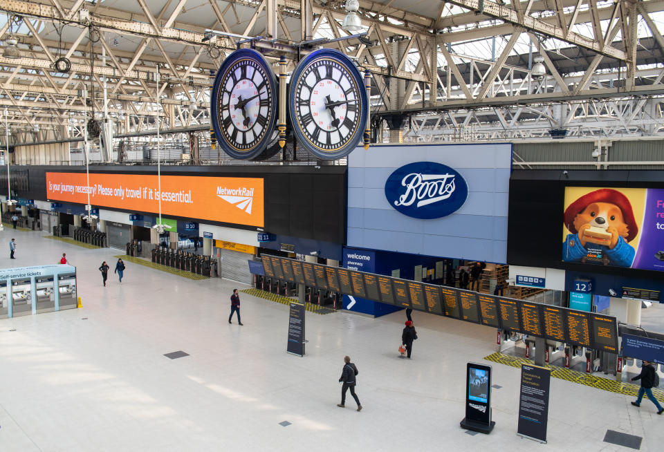 Travellers at a largely empty Waterloo station, in London, as the UK continues in lockdown to help curb the spread of the coronavirus.