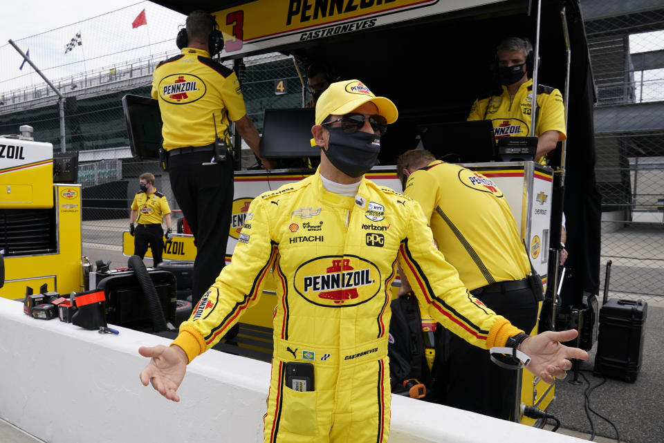 Helio Castroneves, of Brazil, reacts during a practice session for the Indianapolis 500 auto race at Indianapolis Motor Speedway, Wednesday, Aug. 12, 2020, in Indianapolis. (AP Photo/Darron Cummings)