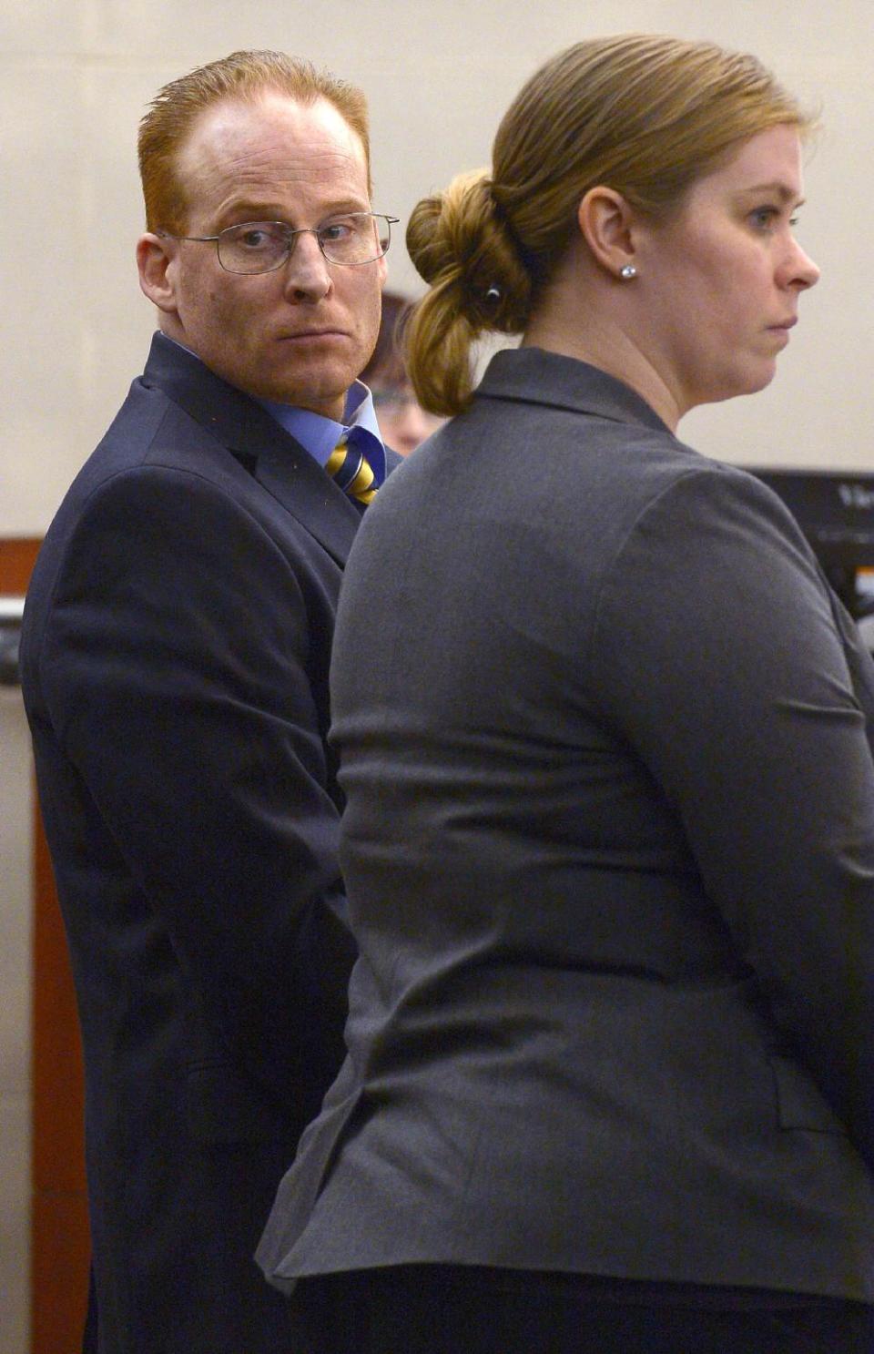 Eric Millerberg watches as attendants at his trial file out of the courtroom, Wednesday, Feb. 12, 2014, in Ogden, Utah. Millerberg has been charged with injecting his 16-year-old baby sitter, Alexis Rasmussen, with a fatal dose of heroin and methamphetamine, then taking his wife and infant daughter along to dump Rasmussen's body near a river. (AP Photo/The Salt Lake Tribune, Leah Hogsten, Pool)