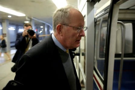 FILE PHOTO: Senate Health, Education, Labor and Pensions Committee Chairman Lamar Alexander (R-TN)  boards the subway on Capitol Hill in Washington, U.S., October 18, 2017.   REUTERS/Joshua Roberts