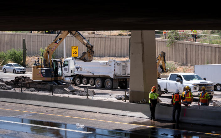 Work continues on repairing a broken water line beneath the Superstition Freeway on May 9, 2022, at McClintock Drive in Tempe, Arizona. The Superstition Freeway is closed between I-10 and Loop 101.