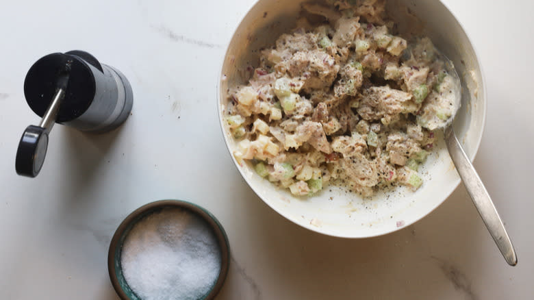 Salt and pepper on salad