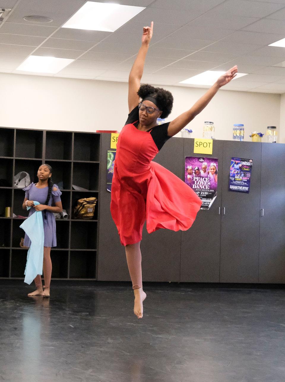 Students in the Tuscaloosa Fine Arts Academy at Paul W. Bryant High School rehearse for their roles Monday in the Tuscaloosa Symphony Orchestra's annual young people's concert "Give Me Space." Jala Poke rehearses a number that will be a duet when danced at the Sunday concert.