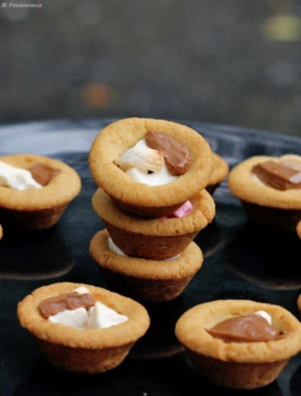 <p>Foodomania</p><p>Enjoy some campfire fun from inside the warm house.<br></p><p><strong>Get the recipe: <a href="https://foodomania.com/smores-cookie-cups/" rel="nofollow noopener" target="_blank" data-ylk="slk:S'mores Cookie Cups;elm:context_link;itc:0;sec:content-canvas" class="link ">S'mores Cookie Cups</a></strong></p>
