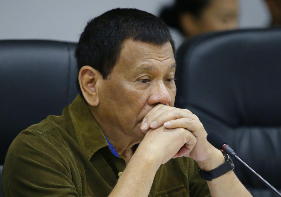 Philippine President Rodrigo Duterte attends a command conference at the National Disaster Risk Reduction and Management Council operations center in metropolitan Manila, Philippines on Thursday, Sept. 13, 2018. The Philippine officials have begun evacuating thousands of people in the path of the most powerful typhoon this year, closing schools and readying bulldozers for landslides. (AP Photo/Aaron Favila)