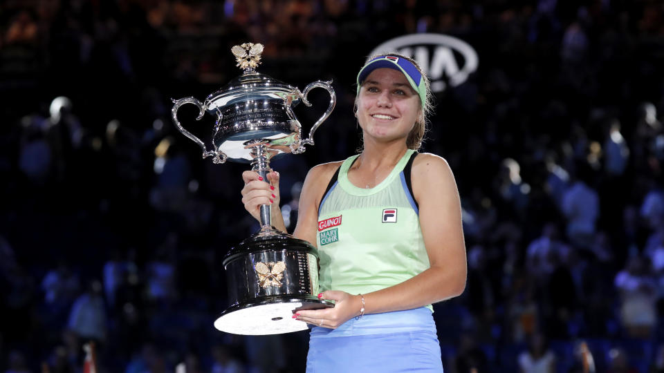 Sofia Kenin of the U.S. holds the Daphne Akhurst Memorial Cup after defeating Spain's Garbine Muguruza in the women's singles final at the Australian Open tennis championship in Melbourne, Australia, Saturday, Feb. 1, 2020. (AP Photo/Lee Jin-man)