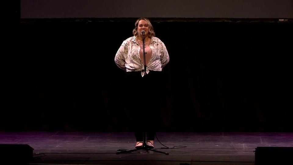 Sam Freese shares their story during the Des Moines Storytellers Project's "Love" at Hoyt Sherman Place on Tuesday, Feb. 14, 2023.