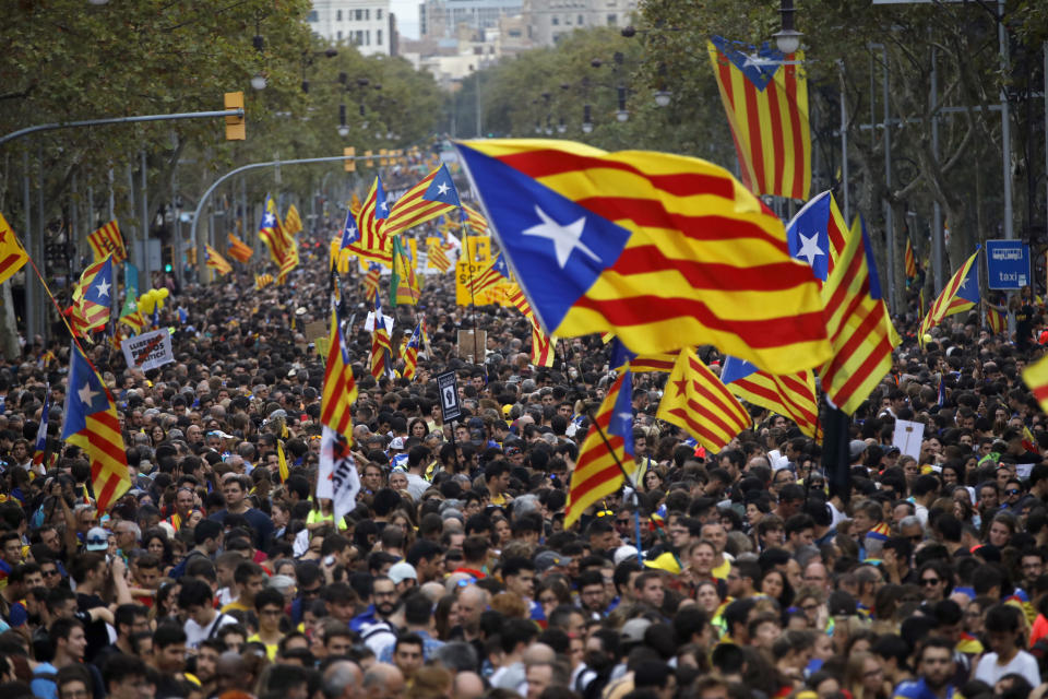 Protestors wave Estelada pro-independence flags during a demonstration in Barcelona, Spain, Friday, Oct. 18, 2019.The Catalan regional capital is bracing for a fifth day of protests over the conviction of a dozen Catalan independence leaders. Five marches of tens of thousands from inland towns are converging in Barcelona's center for a mass protest. (AP Photo/Emilio Morenatti)