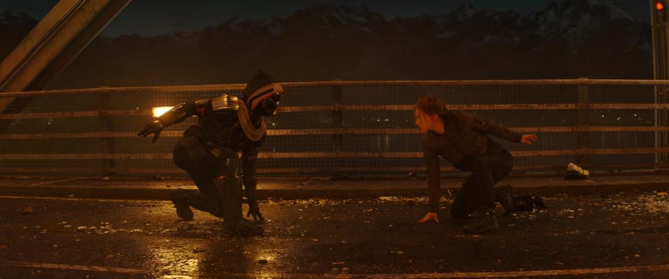 Natasha Romanoff (Scarlett Johansson, right) battles the mysterious Taskmaster, who can mimic an opponent's fighting style in the Marvel superhero film "Black Widow."
