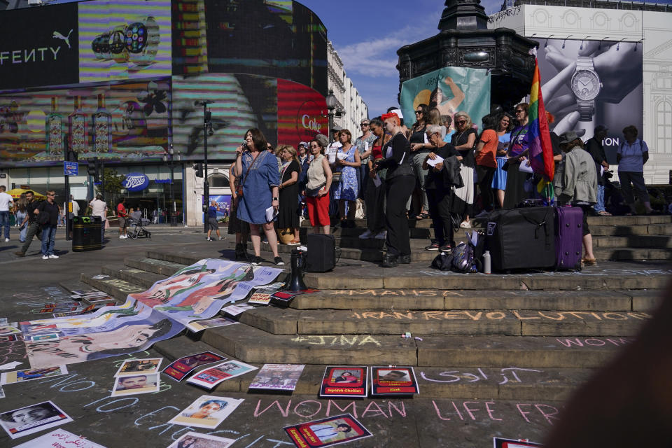 Human rights activist Maryam Namazie speaks at a protest in Piccadilly Circus,in London, Saturday, Sept. 16, 2023, as today marks the anniversary of the death of Mahsa Amini in Iran. (AP Photo/Alberto Pezzali)