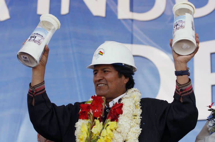 Bolivia's President Evo Morales holds containers with lithium carbonate and potassium produced at the Rio Grande lithium pilot plant, during a visit to the facility in Salar de Uyuni, southern Bolivia Thursday October 29, 2009. Salar de Uyuni is the world's largest salt flat at 10,582 km? (4,085 square miles) and holds around half the world's reserves of lithium. (Photo: Juan Karita/AP)