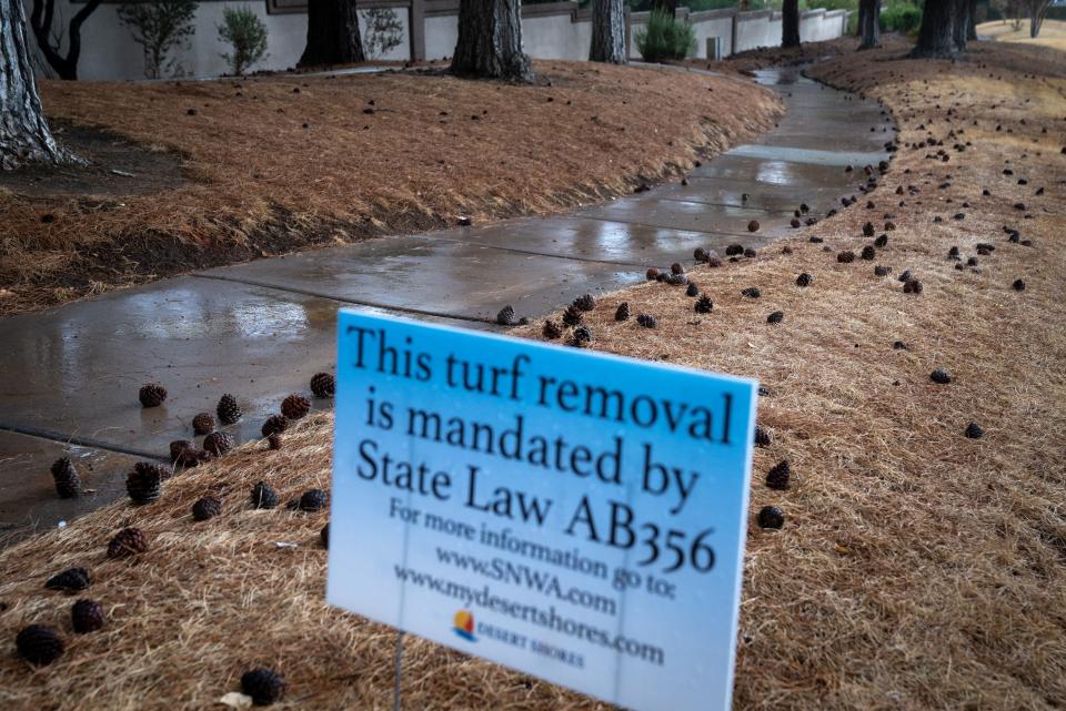 A Desert Shores turf removal notice on a rainy Sept. 28, 2022, in Las Vegas. Because of restrictions and other conservation efforts, Las Vegas uses less water than before the drought.