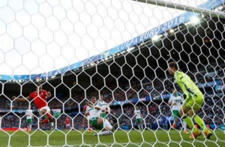 Football Soccer - Wales v Northern Ireland - EURO 2016 - Round of 16 - Parc des Princes, Paris, France - 25/6/16 Northern Ireland's Gareth McAuley scores an own goal and the first for Wales REUTERS/John Sibley Livepic