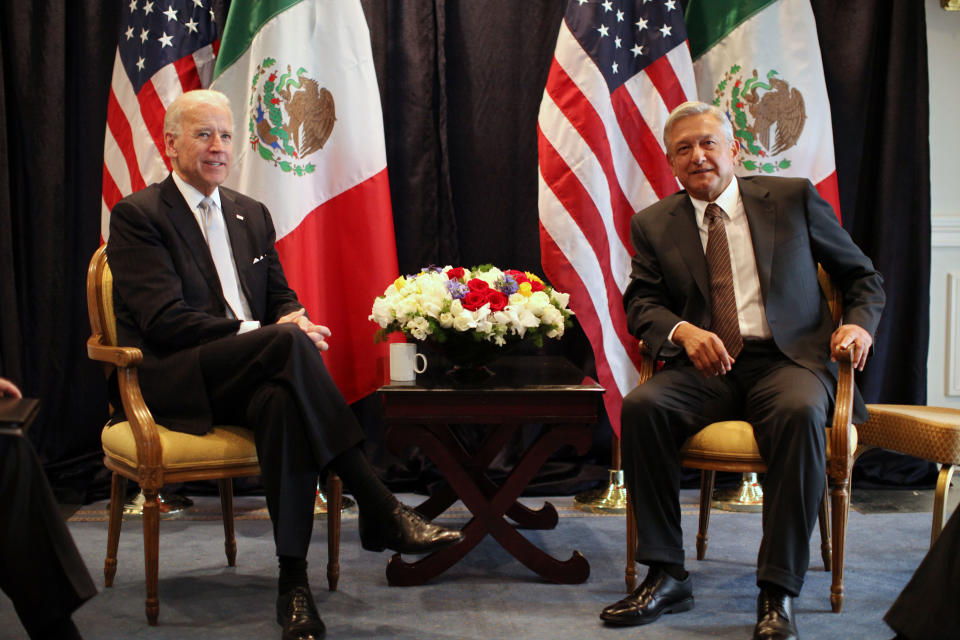 U.S. Vice President Joe Biden, left, poses for photos with Mexican presidential candidate Andres Manuel Lopez Obrador, of the Democratic Revolutionary Party (PRD), Mexico City, Monday March 5, 2012. Biden is on a one-day visit to Mexico. (AP Photo/Alexandre Meneghini)