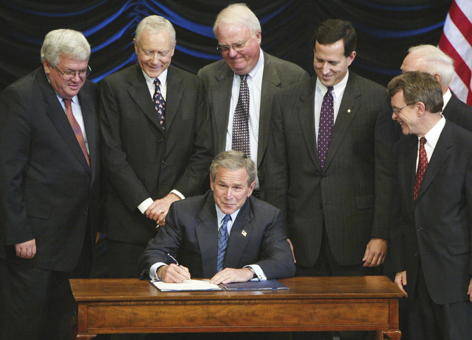 FILE - President George W. Bush signs legislation banning so-called partial-birth abortions, Nov. 5, 2003, in Washington, as from left, House Speaker Dennis Hastert of Ill., Sen. Orrin Hatch, R-Utah, Rep. James Sensenbrenner, R-Wis., Sen. Rick Santorum, R-Pa., Rep. James Oberstar, D-Minn., obscured, and Sen. Mike DeWine, R-Ohio, watch. As campaigning escalates in Ohio's fall fight over abortion rights, a new line of attack from opponents suggests "partial-birth" abortions would be revived if a proposed constitutional amendment passes. But the procedure has been banned nationwide for over 15 years. (AP Photo/Ron Edmonds, File)