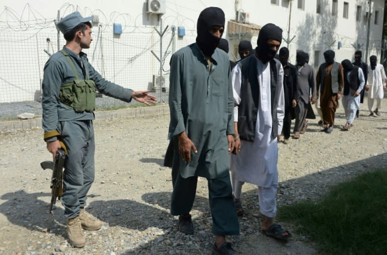 Afghan security forces escorting alleged Islamic State group fighters and Taliban in Jalalabad, amid reports that French and Algerian fighters, some arriving from Syria, have joined the jihadist group in northern Afghanistan