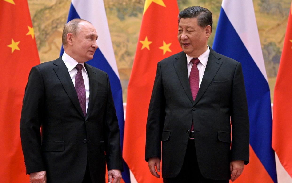 Chinese President Xi Jinping, right, and Russian President Vladimir Putin at the Beijing Winter Olympics - Alexei Druzhinin