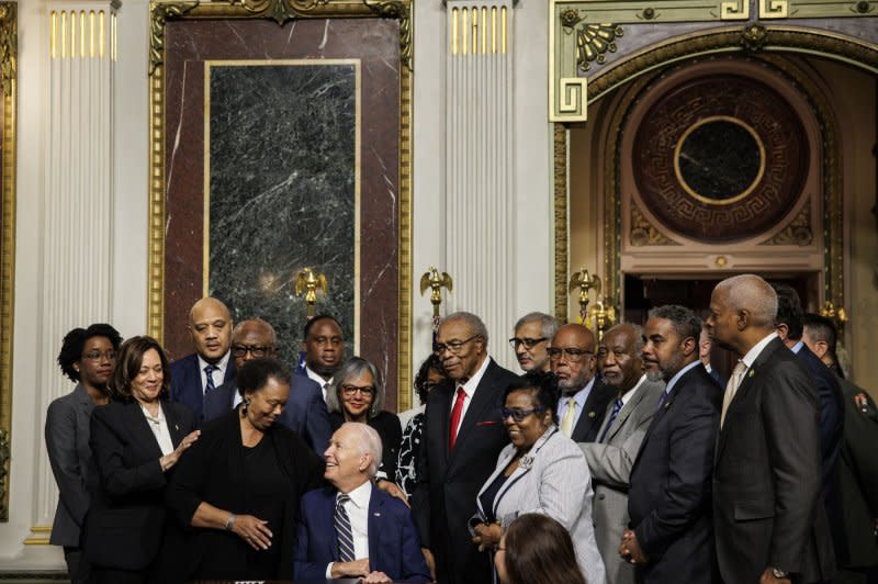 'We gather to remember an act of astonishing violence and hate and to honor the courage of those who called upon on our nation to look with open eyes at that horror and to act,' President Joe Biden (C) said at a signing ceremony on Tuesday in which he designated a trio of monuments to honor Emmett Till and his mother Mamie Till Mobley. Photo by Samuel Corum/UPI