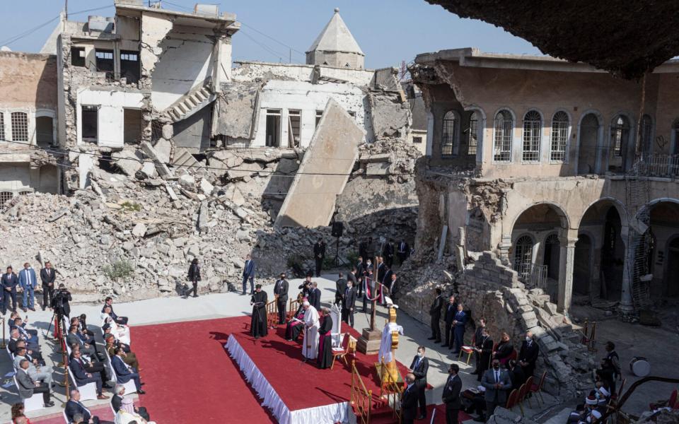 The Pope leading prayers amid the rubble - Sam Tarling for The Telegraph