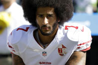 FILE - In this Sept. 25, 2016, file photo, San Francisco 49ers quarterback Colin Kaepernick kneels during the national anthem before an NFL football game against the Seattle Seahawks in Seattle. Kaepernick was a second-round draft pick in 2011 who the next year led the San Francisco 49ers to the Super Bowl. By 2016, he had begun kneeling on the sideline at games during the national anthem to protest social injustice and police brutality. Soon after, he was gone from the NFL, and he has not played since. (AP Photo/Ted S. Warren, File)