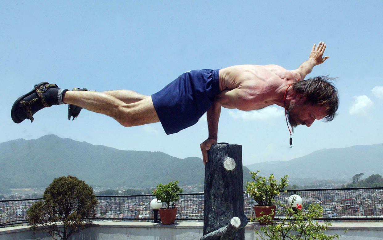 Dutchman Wim Hof, better known as "Iceman" for his ability to withstand seemingly impossible levels of cold, demonstrates at a hotel in Kathmandu, 28 May 2007.   'Iceman', who failed in his attempt to conquer Mount Everest wearing just shorts vowed to have another half-naked crack at the world's highest peak next year. Hof said that next year he would try Everest again, and then with a paraglider and two French people they would fly down.  AFP PHOTO/DEVENDRA M.SINGH (Photo credit should read DEVENDRA MAN SINGH./AFP via Getty Images)