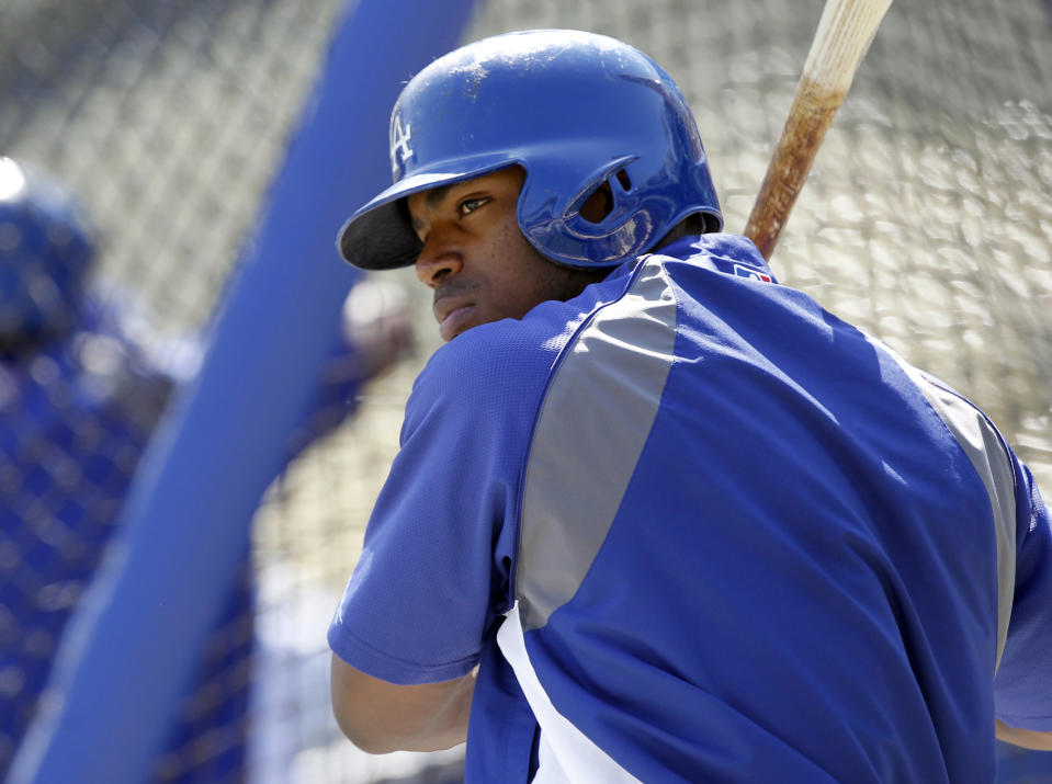 Los Angeles Dodgers' Yasiel Puig warms up at the batting cage prior to a baseball game against the San Francisco Giants on Saturday, April 5, 2014, in Los Angeles. (AP Photo/Alex Gallardo)