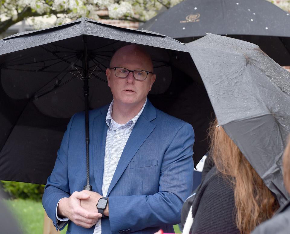 Monroe Public Schools' superintendent Andrew Shaw listens to complaints of bullying and peer mistreatment at the Justice for Gary rally at Monroe Middle School.