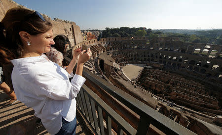 Tourists visit the Colosseum in Rome, Italy, October 17, 2017. Picture taken October 17, 2017. REUTERS/Max Rossi