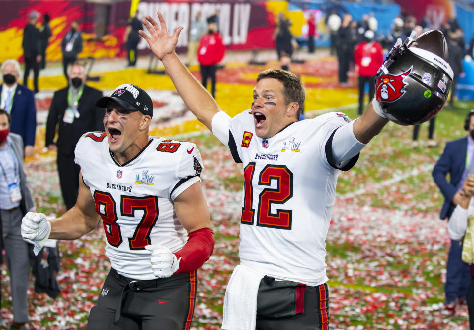 Feb 7, 2021; Tampa, FL, USA;  Tampa Bay Buccaneers quarterback Tom Brady (12) and tight end Rob Gronkowski (87) celebrate after beating the Kansas City Chiefs in Super Bowl LV at Raymond James Stadium.  Mandatory Credit: Mark J. Rebilas-USA TODAY Sports